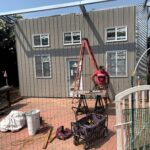 Modern galvanized steel accessory dwelling units in Winnie, Texas, offer stylish and efficient living solutions