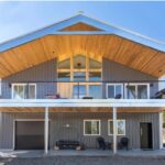 Exterior view of galvanized steel barndominiums in Alpine, Texas showcasing modern design and rural charm