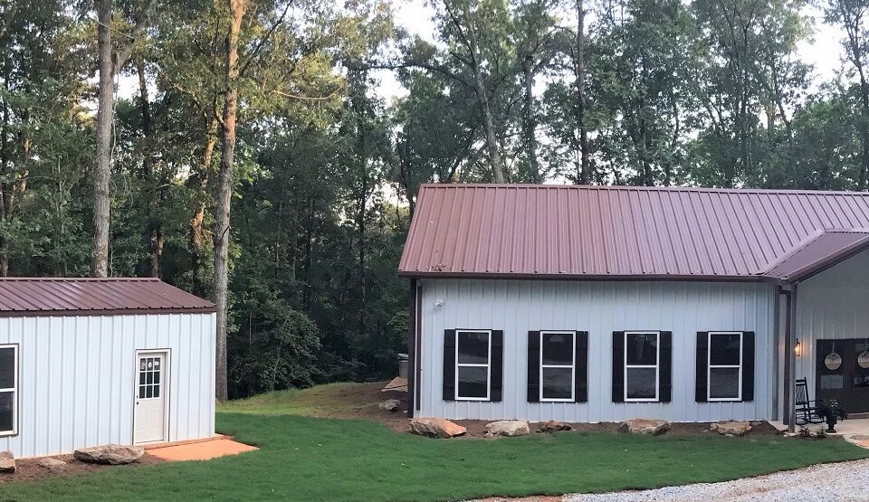 Modern galvanized steel barndominiums in Bacliff, Texas, showcasing rustic charm and durable design