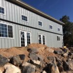 Stylish galvanized steel barndominiums in Bedford, Texas, showcasing modern design and rustic charm