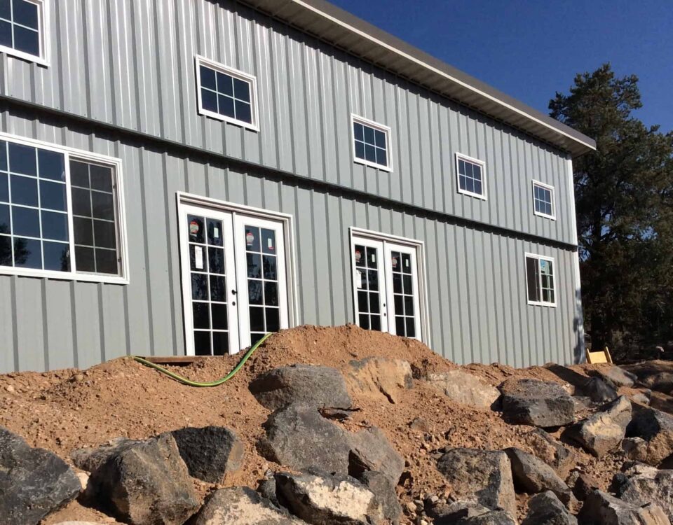 Stylish galvanized steel barndominiums in Bedford, Texas, showcasing modern design and rustic charm