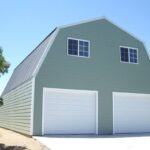 Exterior view of galvanized steel barndominiums in Oak Point, Texas, showcasing modern design and rural charm