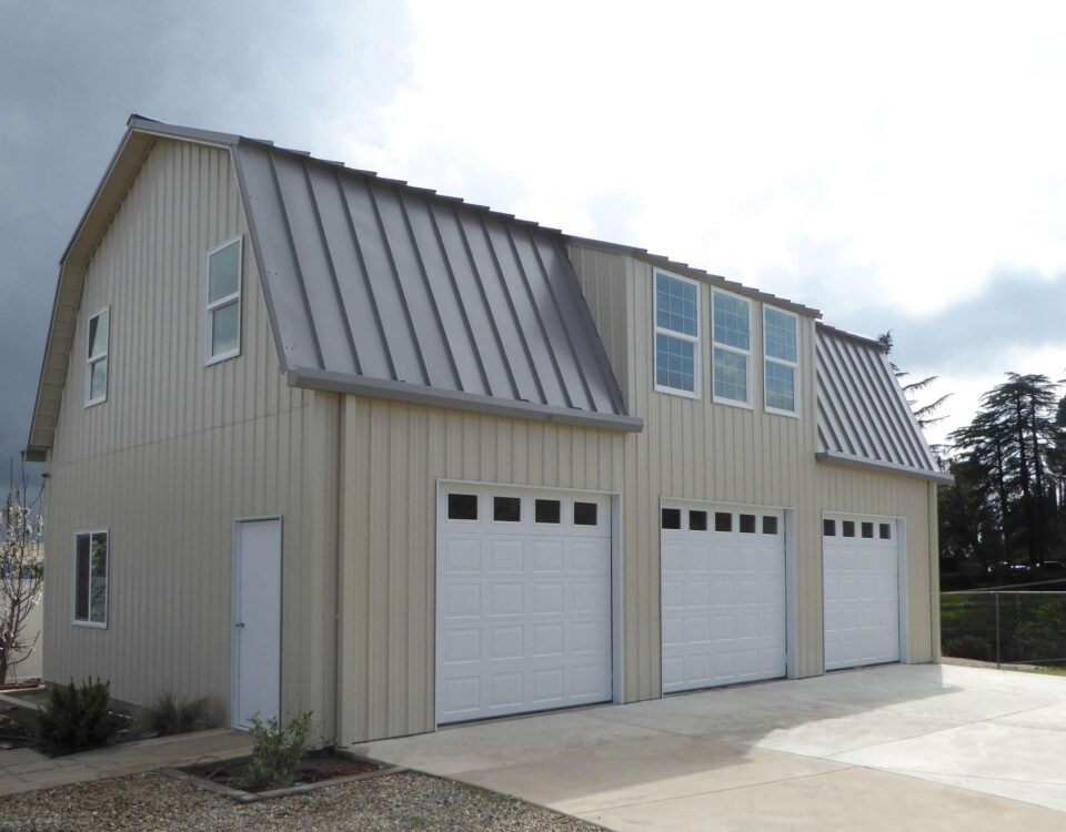 Exterior view of galvanized steel barndominiums in Perezville, Texas, showcasing modern design and rural landscaping