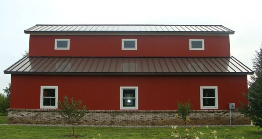 Modern galvanized steel barndominiums in Primera, Texas, showcasing durable construction and stylish design