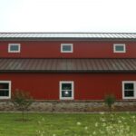 Beautiful galvanized steel barndominiums in Raymondville, Texas, showcasing modern design and rural charm