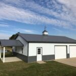 Exterior view of galvanized steel barndominiums in Rocky Ford, Colorado, showcasing modern design and rural charm