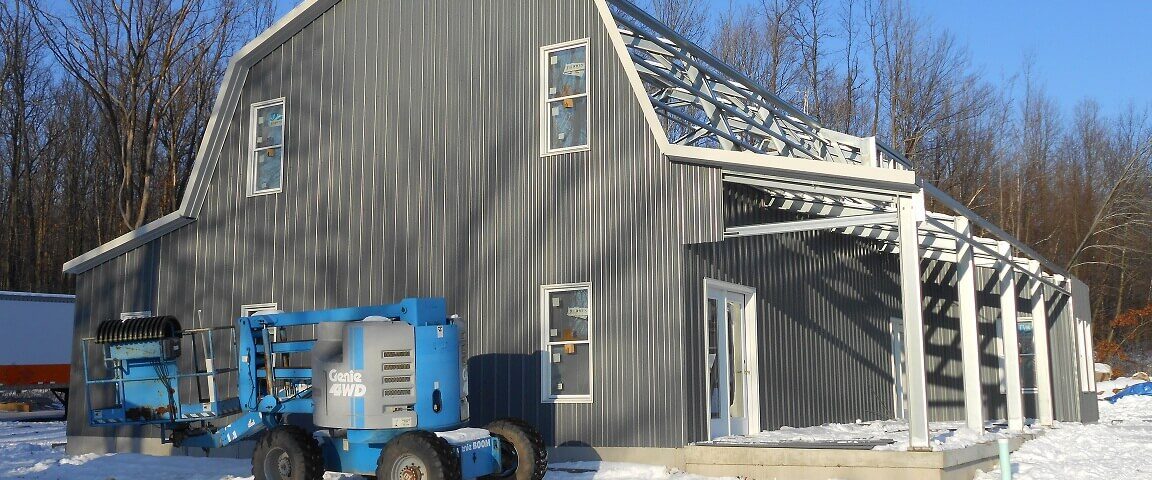 Modern galvanized steel barndominiums in Timberwood Park, Texas, showcasing contemporary design and durability