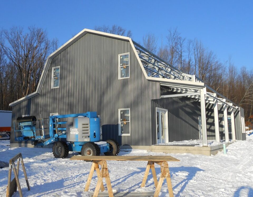 Modern galvanized steel barndominiums in Timberwood Park, Texas, showcasing contemporary design and durability