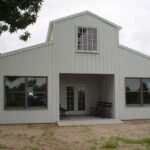 Stunning galvanized steel barndominiums in Trophy Club, Texas, showcasing modern design and rustic charm