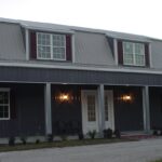 Modern galvanized steel barndominiums in Victoria, Texas, showcasing sleek design and durability in rural living