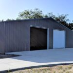 Exterior view of galvanized steel shops in Mineola, Texas, showcasing modern design and durable construction