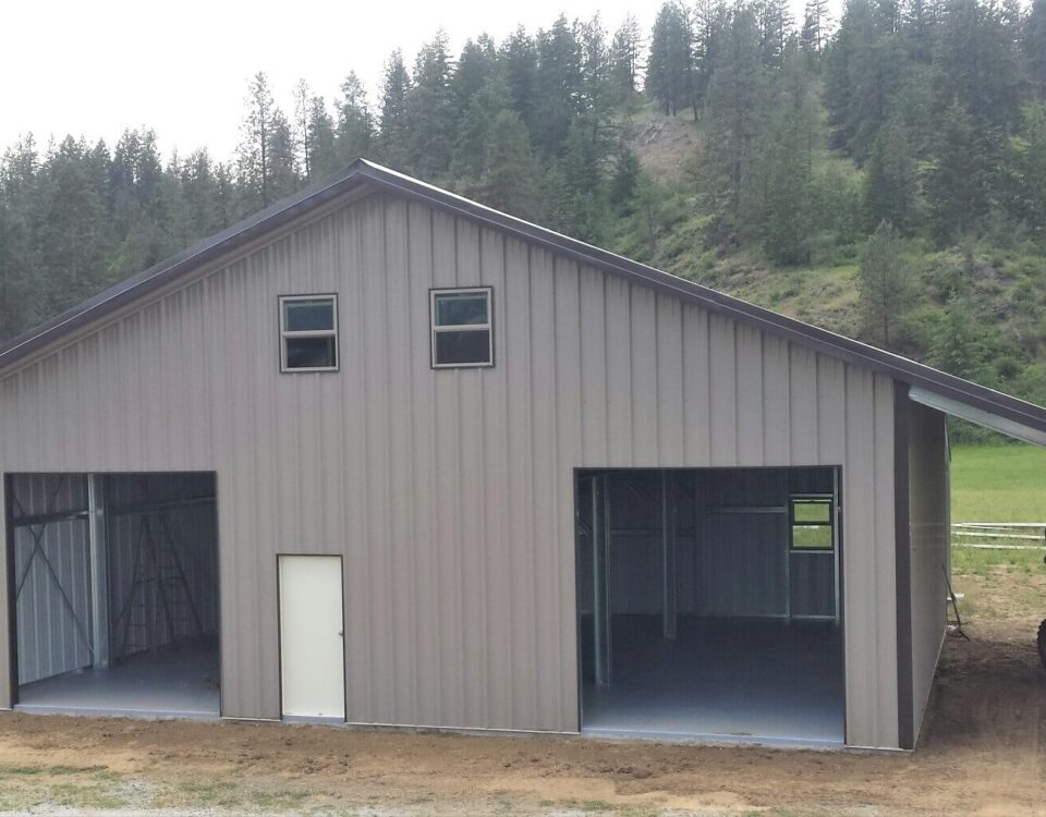 Exterior view of galvanized steel shops in Oak Ridge North, Texas, showcasing modern design and sturdy construction