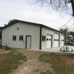 Exterior view of galvanized steel shops in Roma, Texas, showcasing modern design and durability