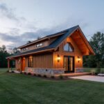 A modern barn-style home showcasing BARNDOMINIUM MODULAR HOMES with spacious living areas and rustic charm.