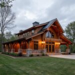 A stunning barndominium with wrap around porch showcasing modern design and rustic charm.