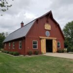 Infographic showing how much does a barndominium cost compared to traditional homes.