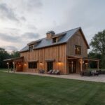 A beautiful L shaped barndominium showcasing modern architecture and spacious living areas.