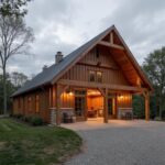 A modern manufactured barndominium showcasing its spacious interior and rustic charm in a picturesque setting.