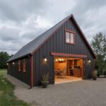 A modern metal barndominium showcasing spacious living areas and a sleek exterior design.