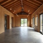 Spacious open floor plan barndominium highlighting modern design and natural light.